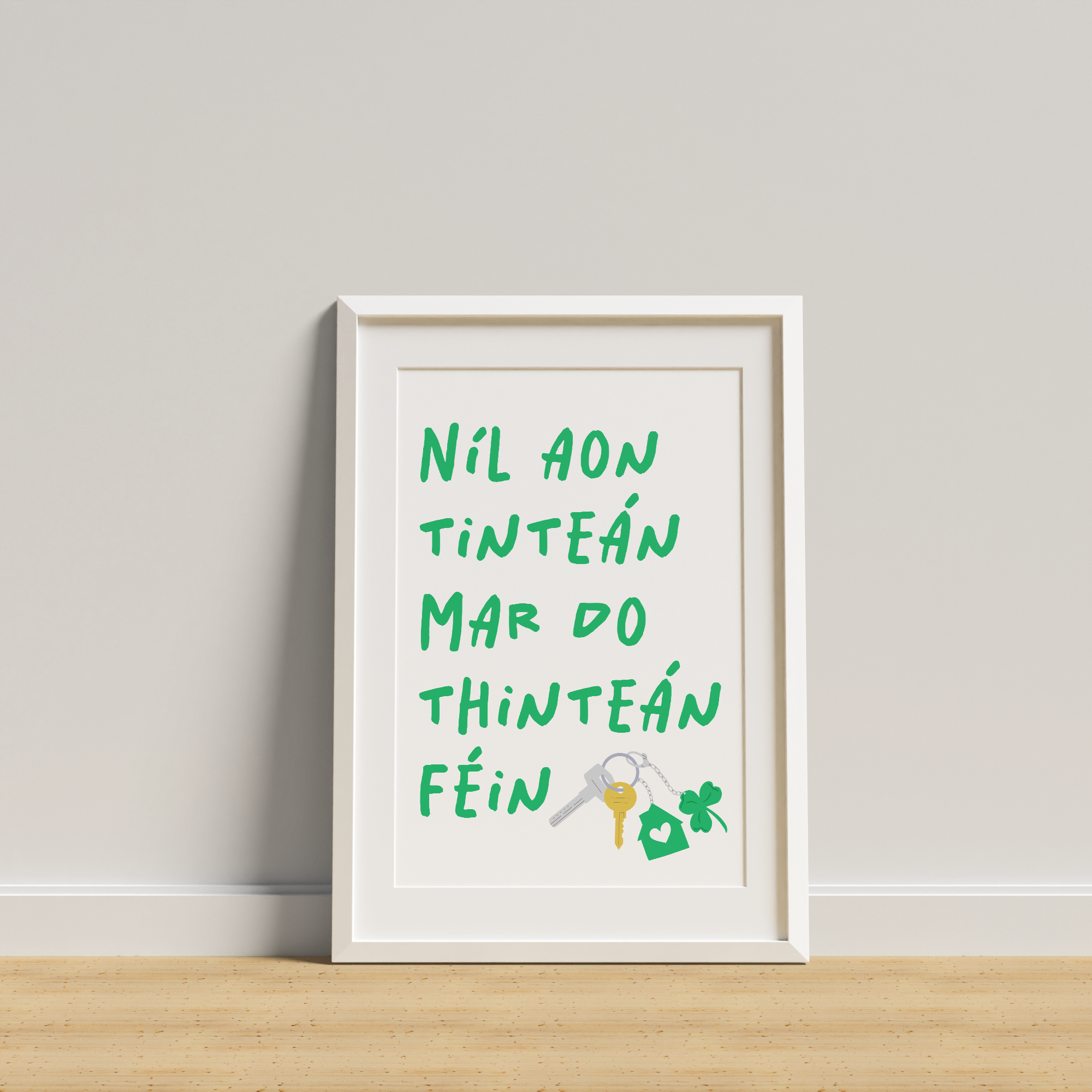 Framed artwork with text and a key symbol on a white wall.